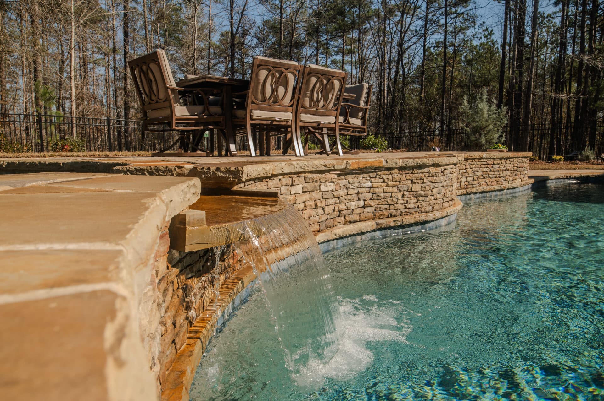 close up shot of waterfall and hot tub feature