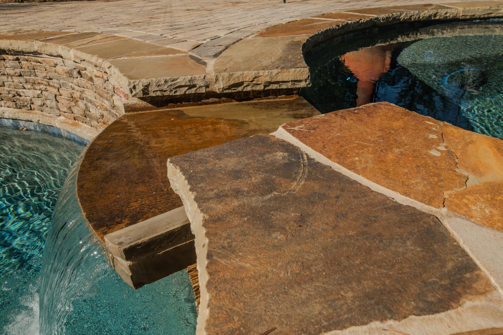 close up shot of hot tub with waterfall