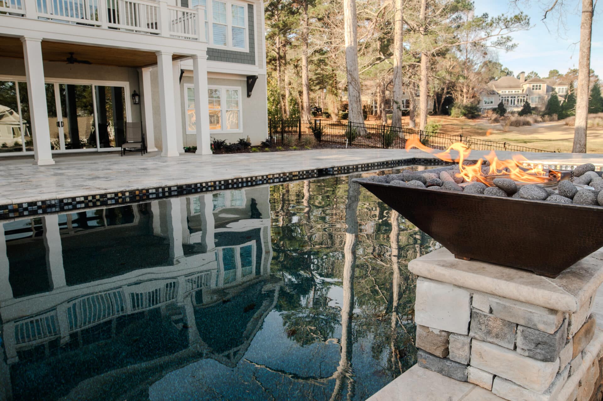 close up shot of pool with fire pits