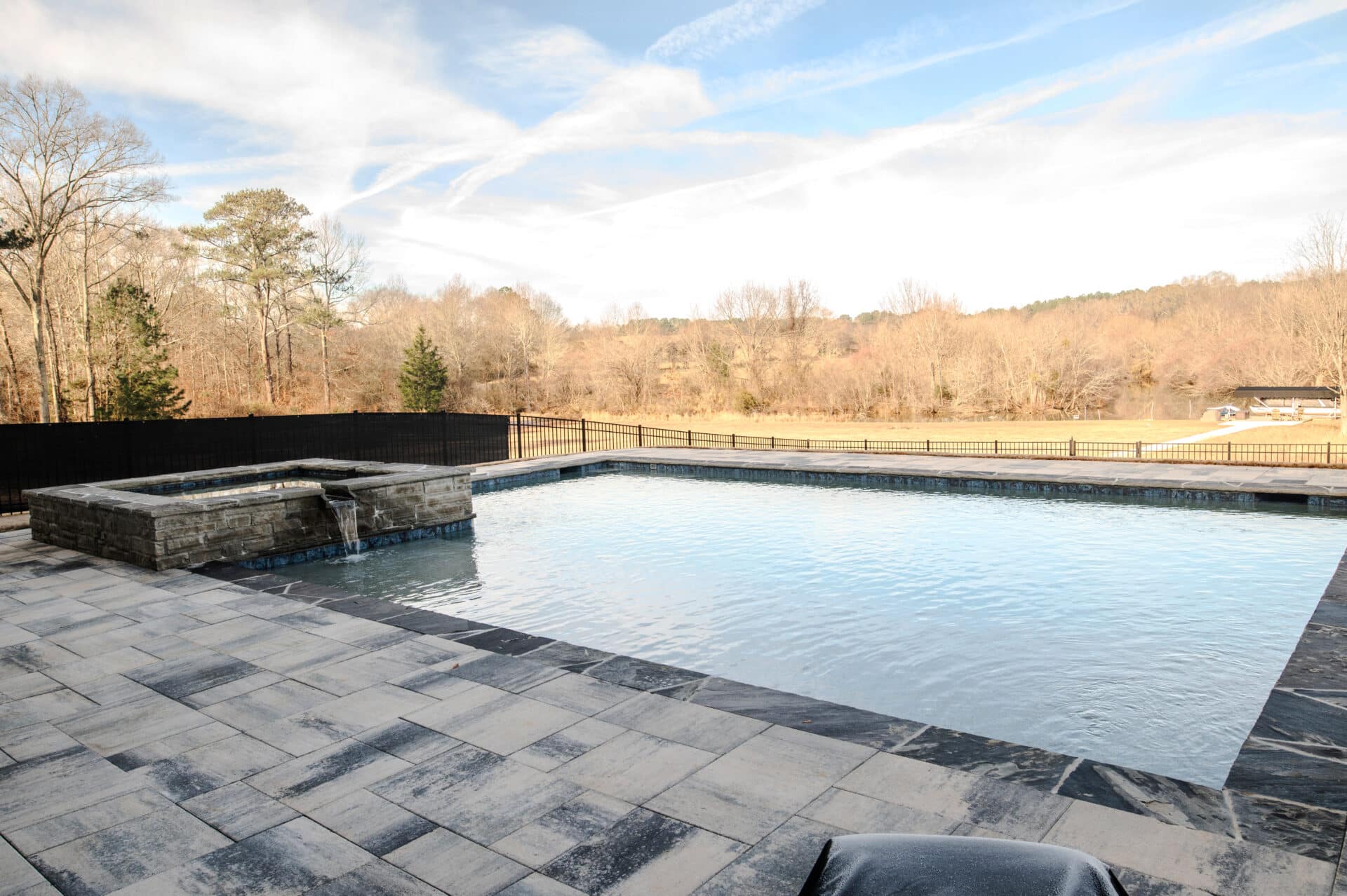 Lake Country Pools project with hot tub and waterfalls