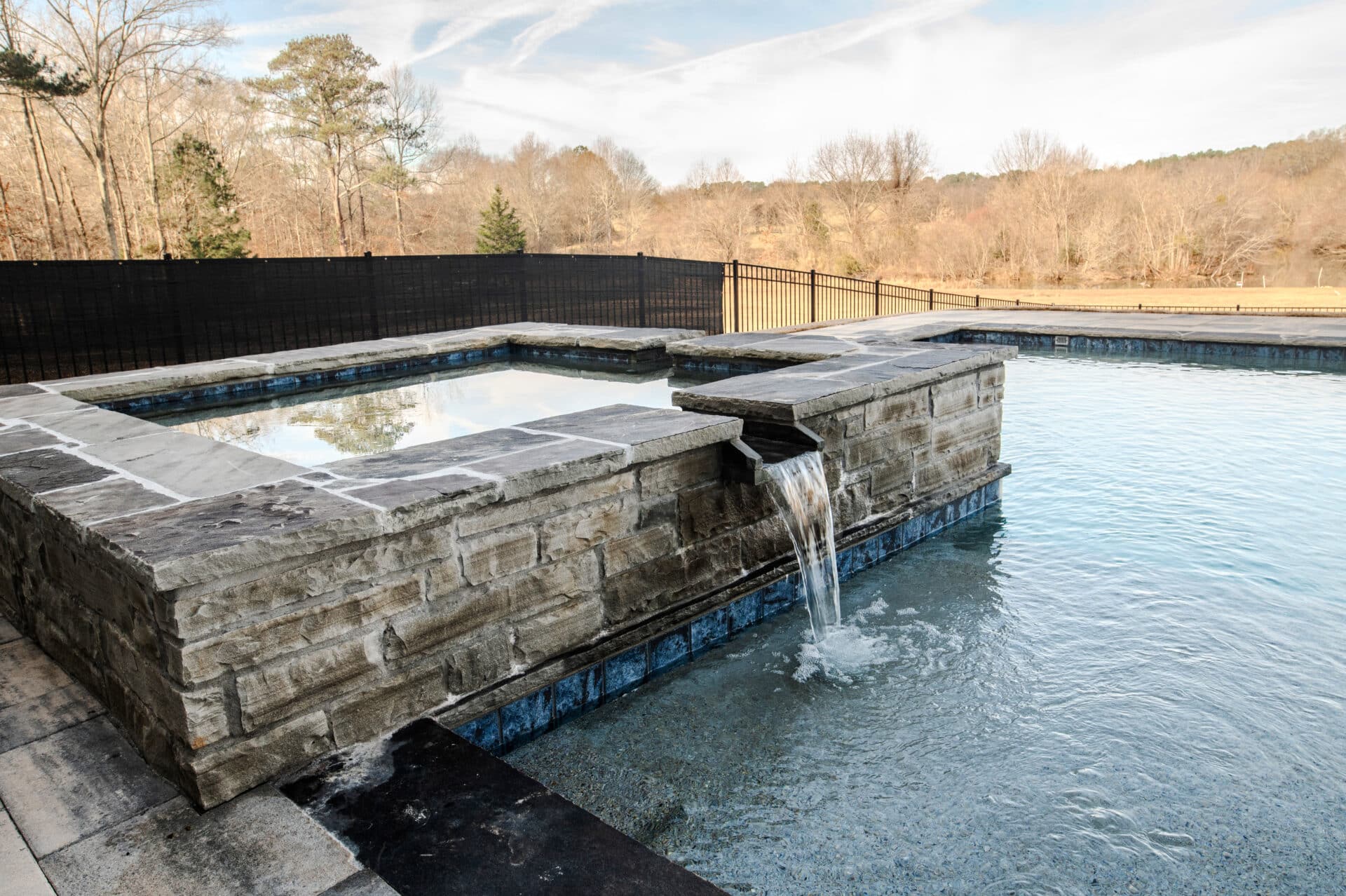 Lake Country Pools project with hot tub and waterfalls