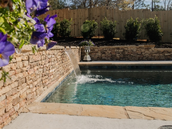 Lake Country Pools project with hot tub and waterfalls