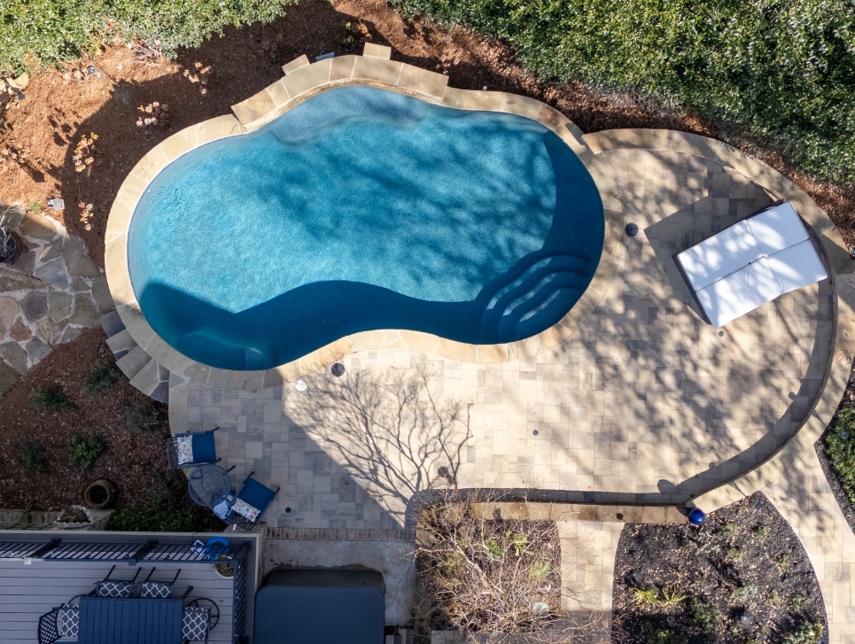 birds eye view of a lake country pools project